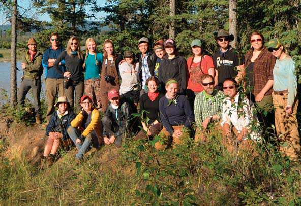 Group of researchers standing together and posing for a group photo.