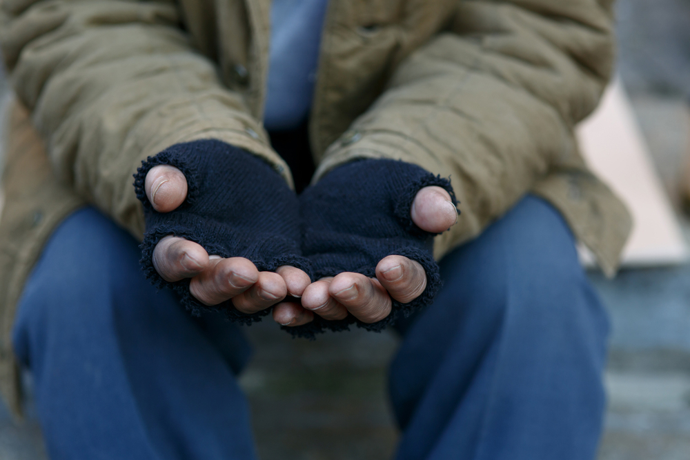 Hands in Gloves reaching out