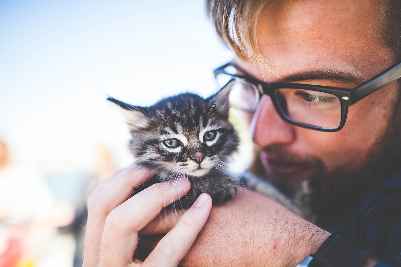 man and kitten