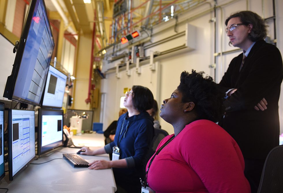 Assistant Professor Ivan Fabe Dempsey Hyatt, PhD, and Adelphi student Marly Medard working at the synchrotron.