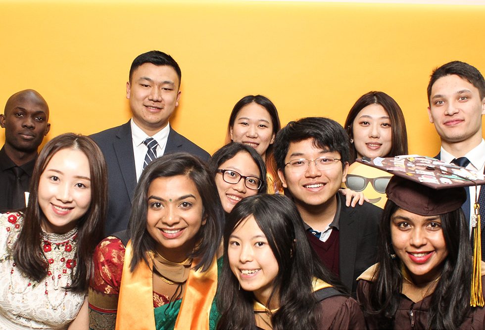 International students gathered together in a photobooth at Adelphi