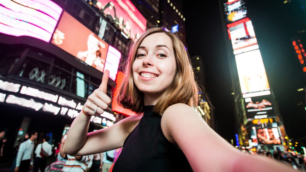 Adelphi first-year student in the heart of time square NYC