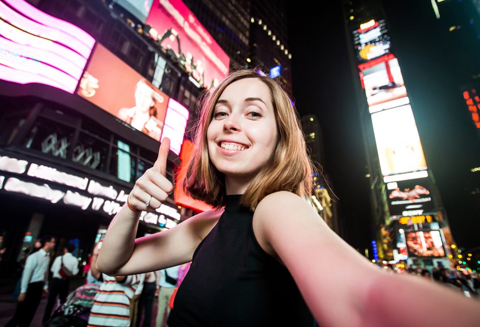Adelphi first-year student in the heart of time square NYC