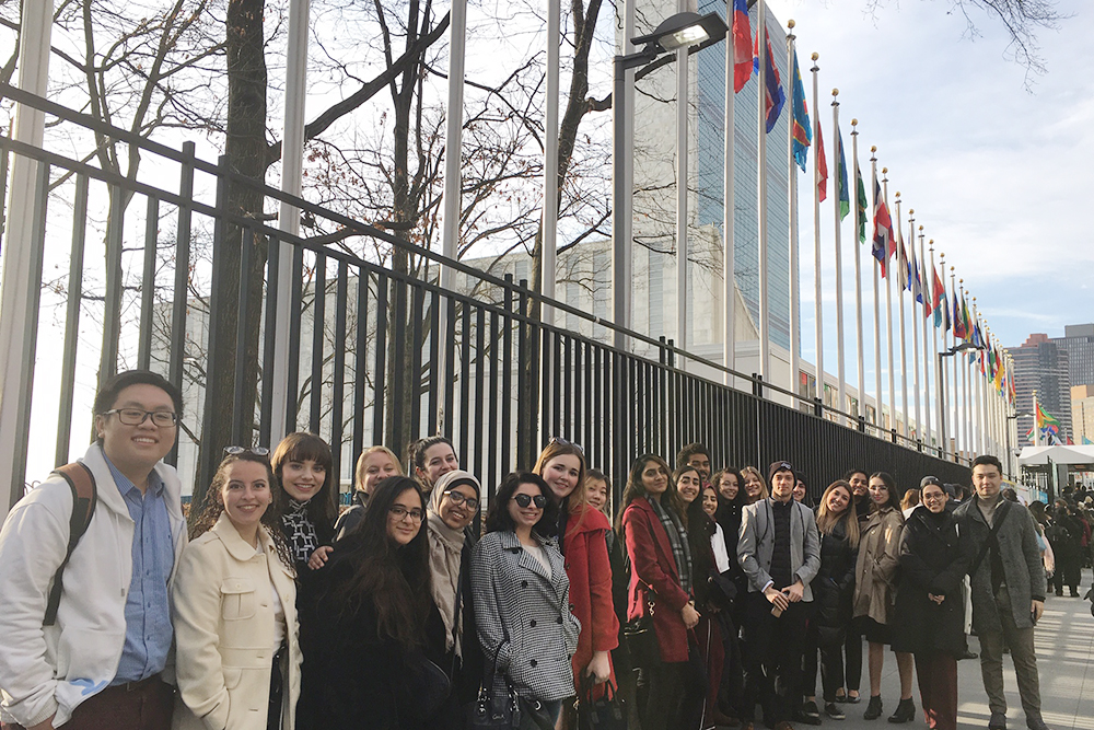 LGS students standing by the UN flags in NYC.