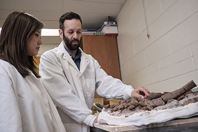 Sae Bom Ra 19' with Professor D'Emic looking at fossils