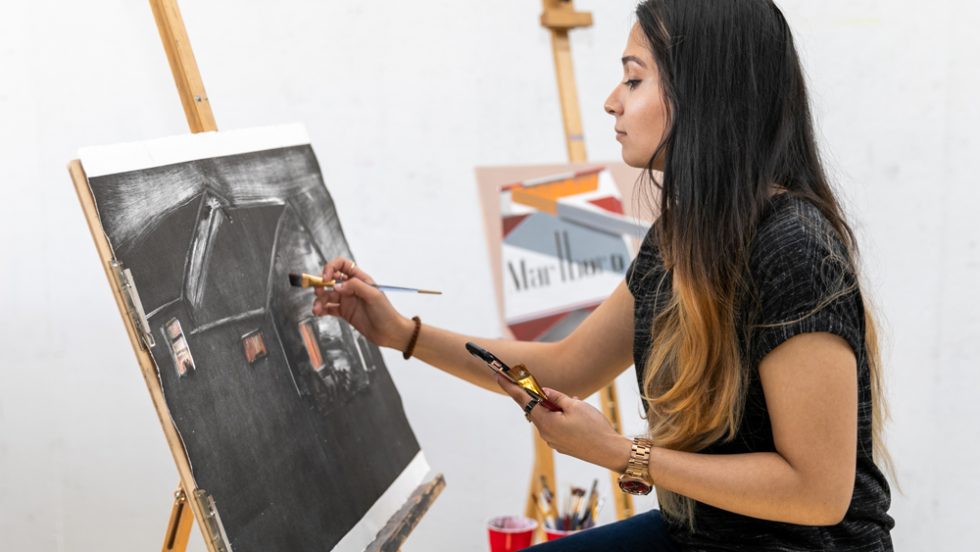 Ruth Militrano '19 painting in the studio