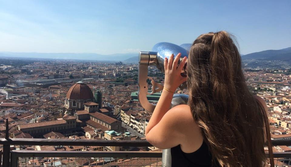 Adelphi University Study Abroad: Student looking through a viewfinder in Florence, Italy