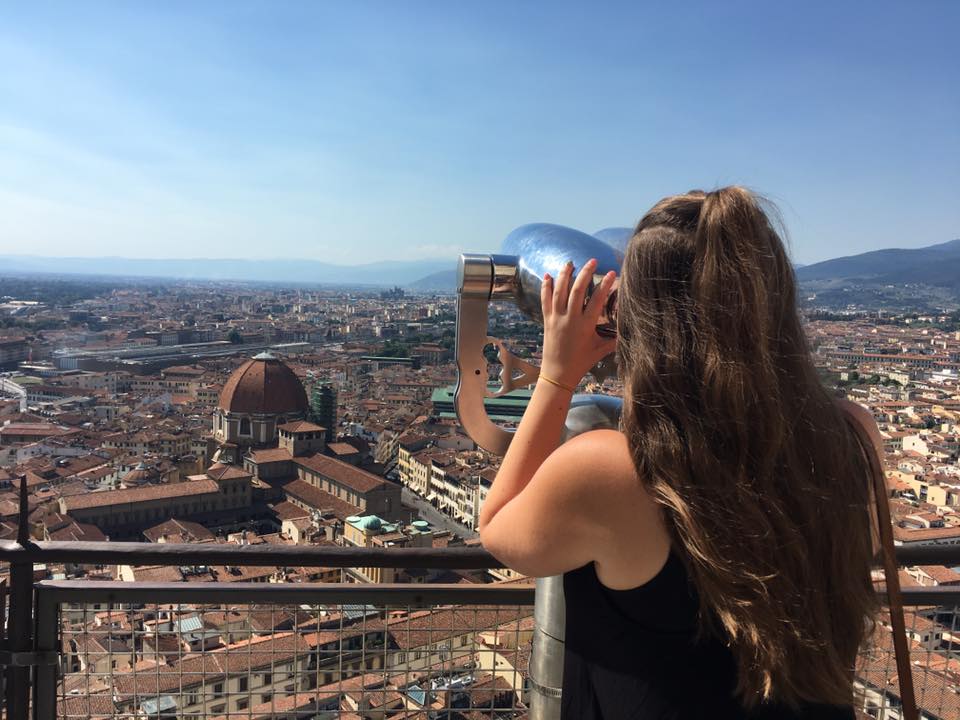 Adelphi University Study Abroad: Student looking through a viewfinder in Florence, Italy