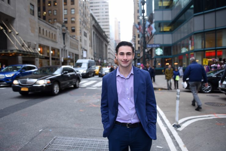 Nicholas Sterlacci standing on a busy NYC street
