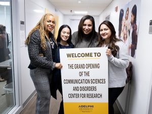 Adelphi faculty and students at the grand opening of the Communication Sciences and Disorders Center for Research.