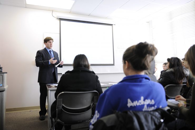 Professor Peter DeBartolo in front of a class of students