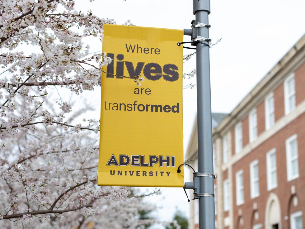 Adelphi University banner that reads "where lives are transformed"