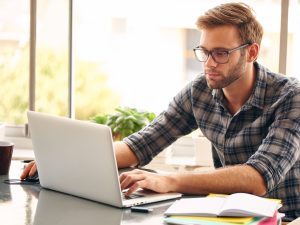 Student taking an online course on her laptop.