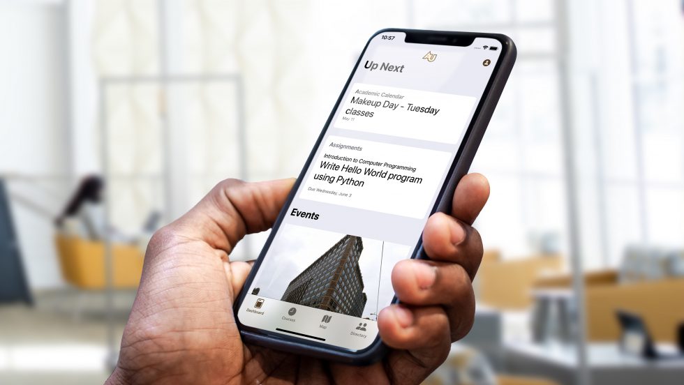 A person holding their phone with the new app up in the University Center