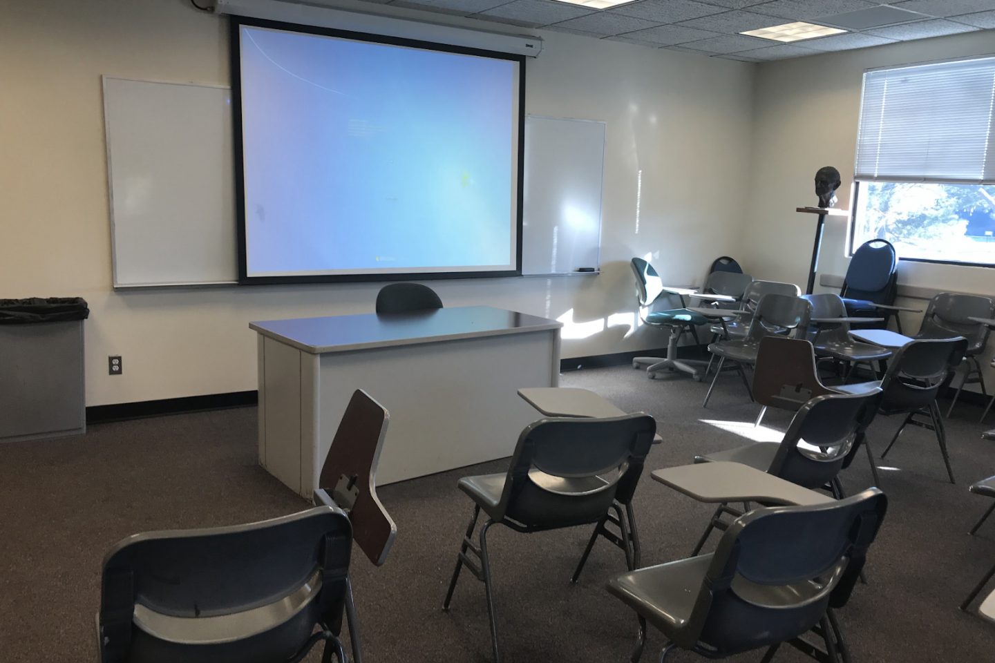 A view of the goodyear lab showing desks and projector