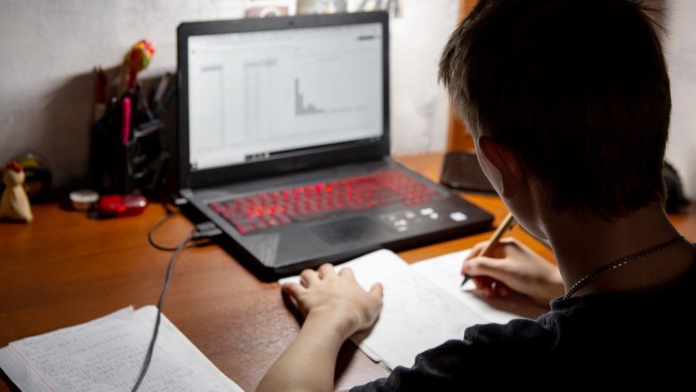 A student working on a laptop.