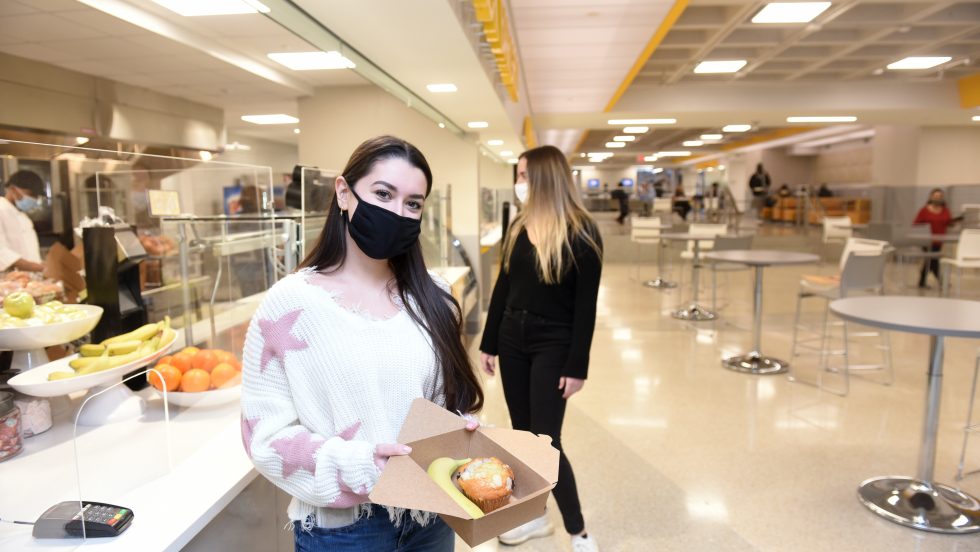 Adelphi students getting food in the newly renovated University Center while wearing masks during the COVID-19 pandemic.