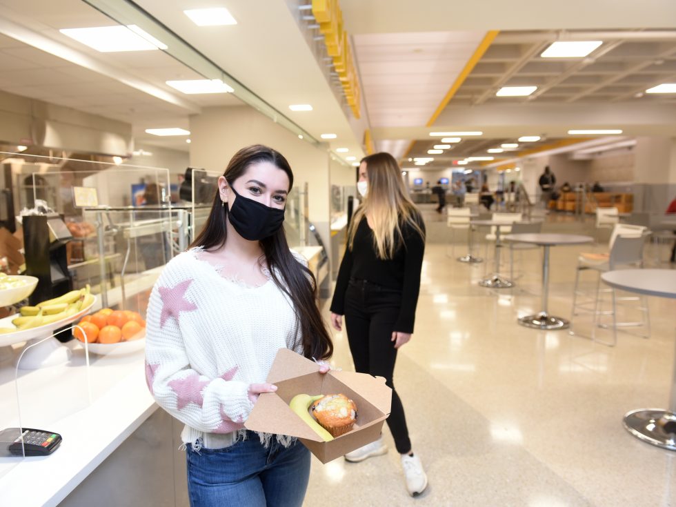 Adelphi students getting food in the newly renovated University Center while wearing masks during the COVID-19 pandemic.