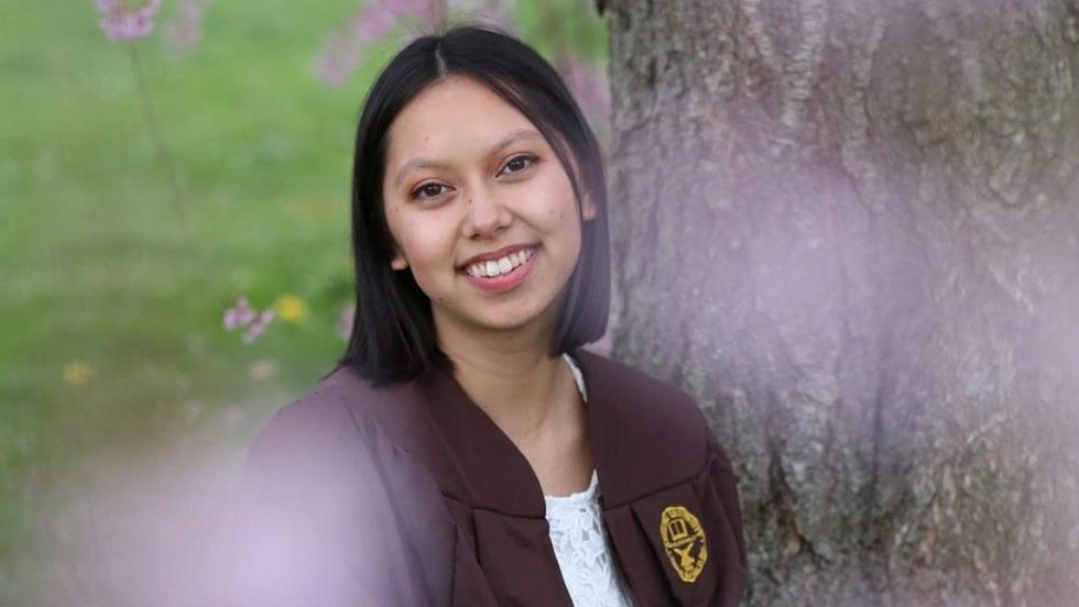 Gabi Vidad wearing her commencement regalia.