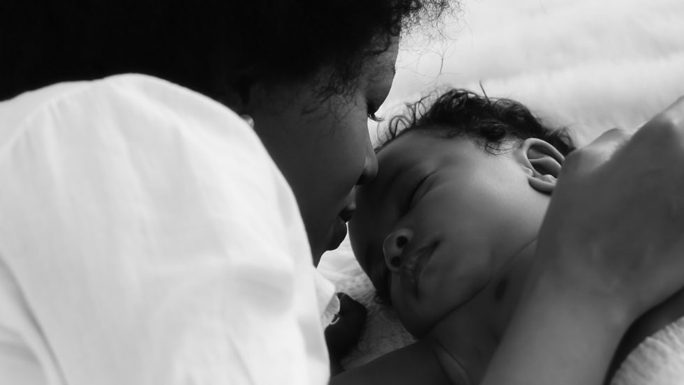 Mother and infant in black and white