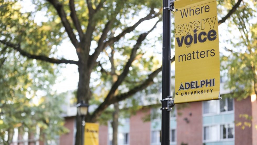 "Where every voice matters" Adelphi University banner shown on campus