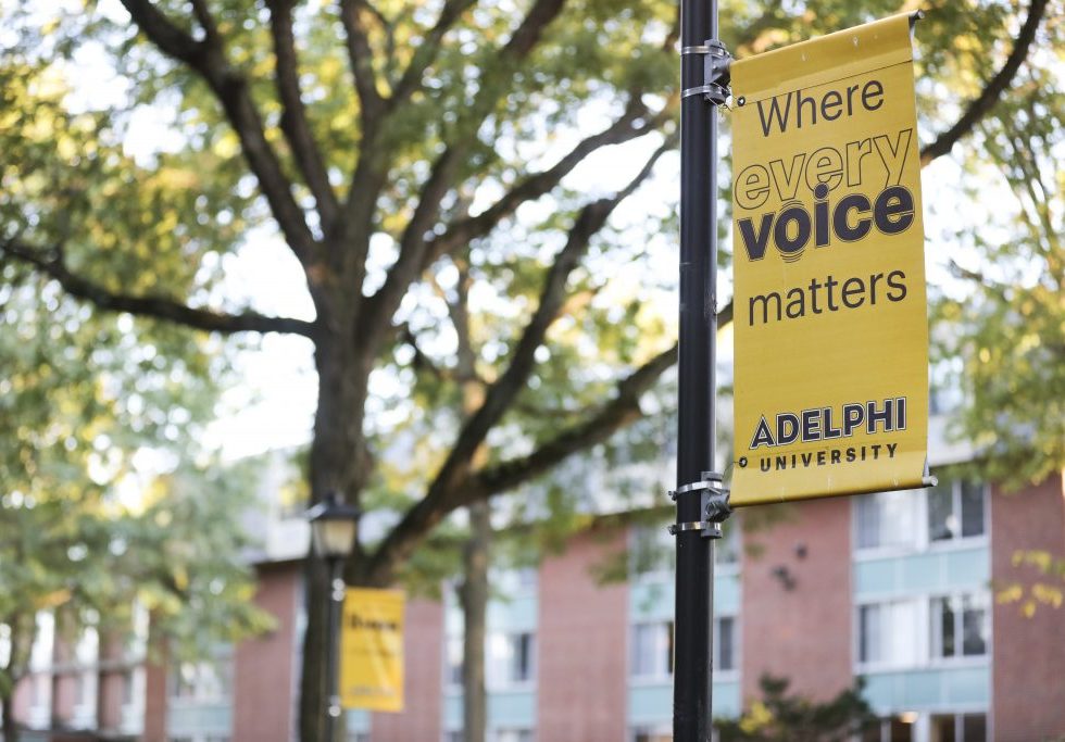 "Where every voice matters" Adelphi University banner shown on campus