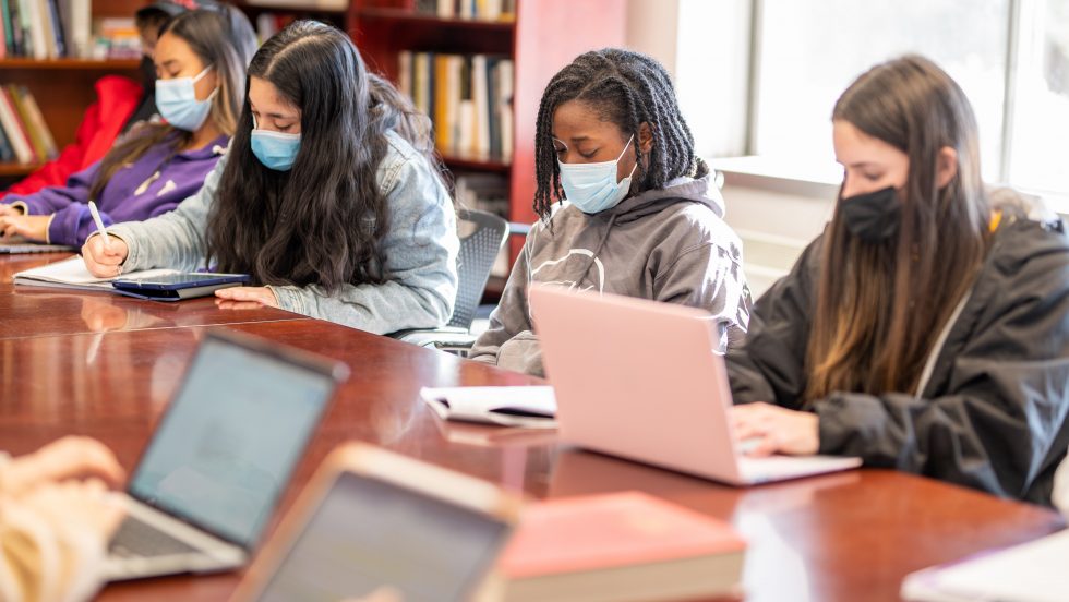 Adelphi Honors College students wearing masks in a classroom