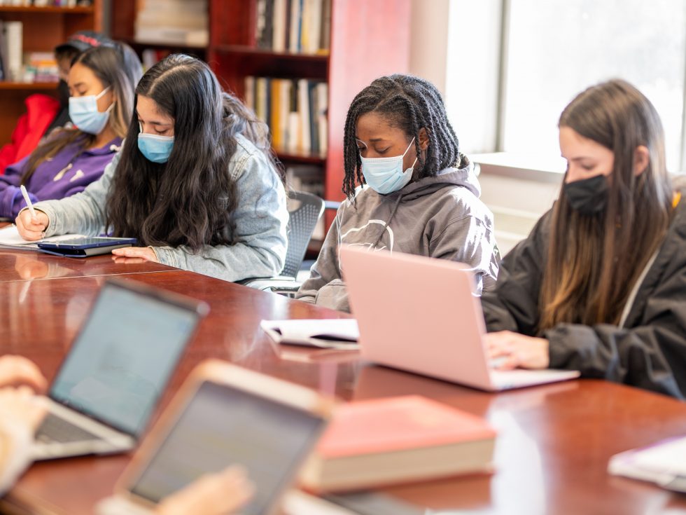 Adelphi Honors College students wearing masks in a classroom