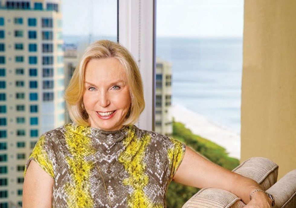 Paula Malone seated near a window.