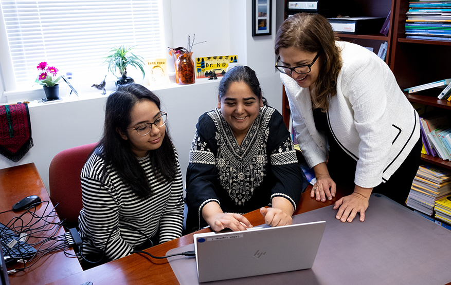 Professor of communication sciences and disorders Reem Khamis, PhD working closely with CSD students