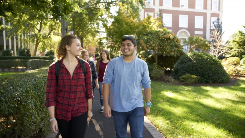 Adelphi students walking on campus right near Blodgett Hall.