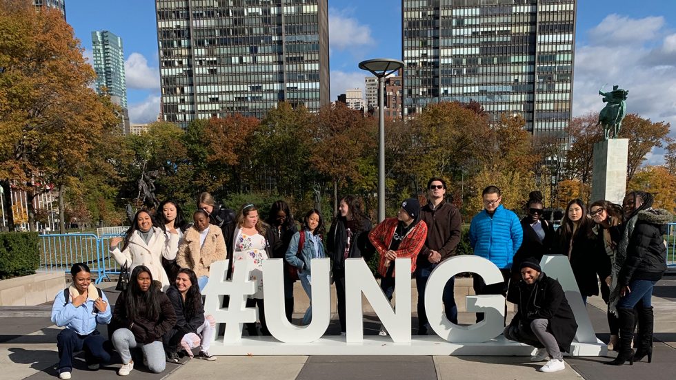 Students standing in front of the #UNGA sign in New York City