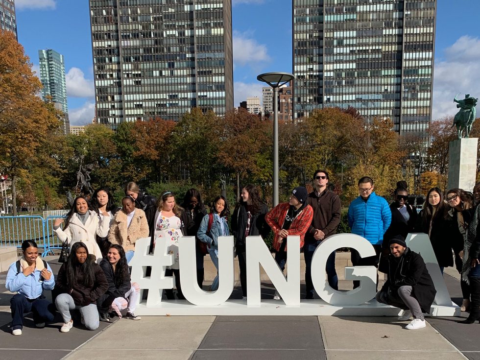 Students standing in front of the #UNGA sign in New York City