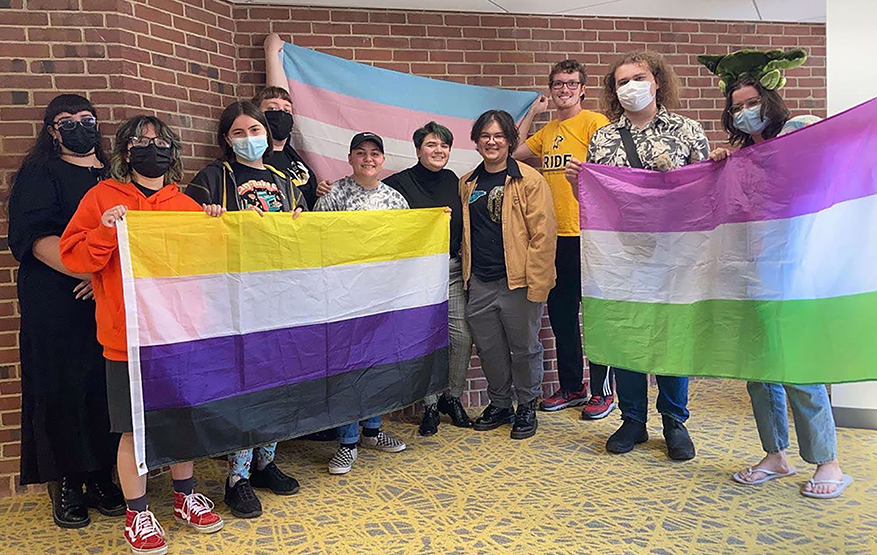 Community members with different pride flags