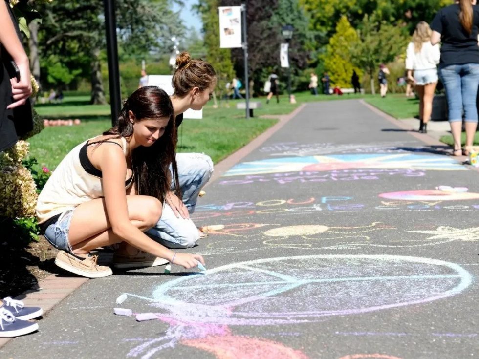 Students participating in Chalk Up at Adelphi's Fall Arts Festival. (Adelphi University)