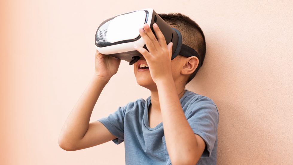 A child wears a VR headset