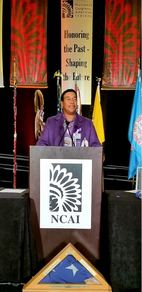 Lance A. Gumbs '93 speaking at NCAI