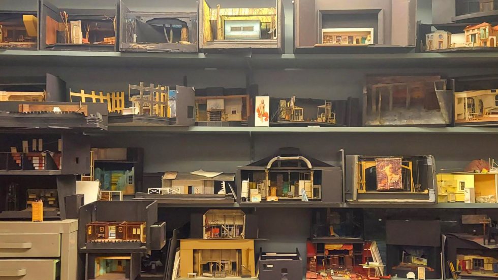 John McDermott's miniature set designs on shelves