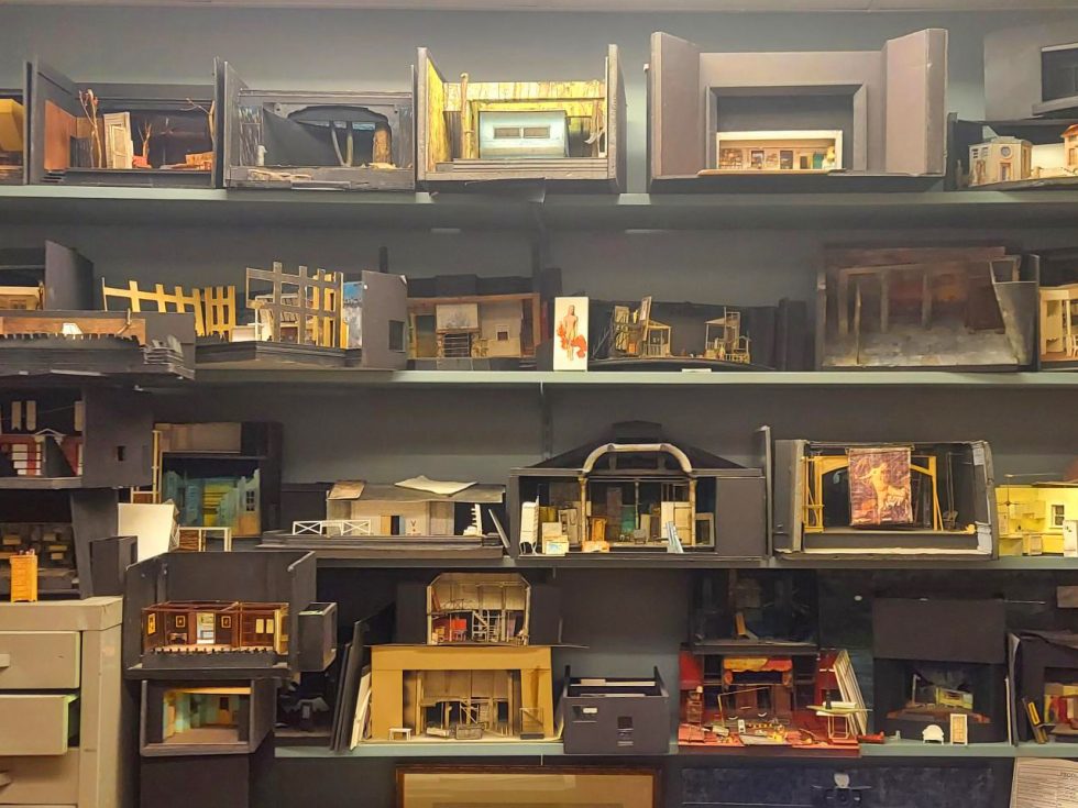 John McDermott's miniature set designs on shelves