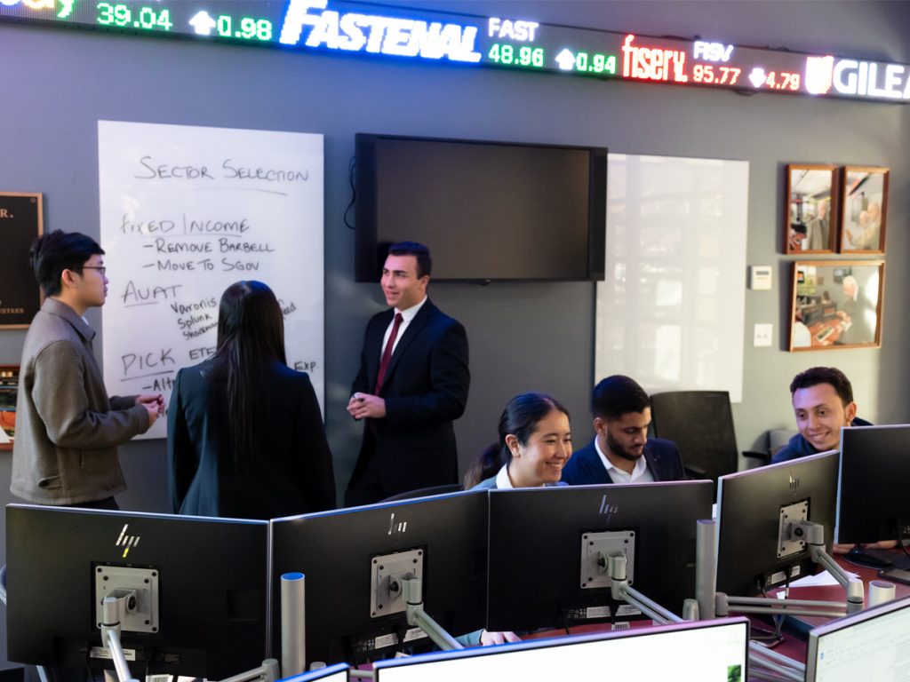 Adelphi Students working in the James Riley Jr. Trading Room