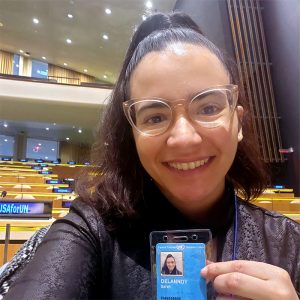 Sarah Delannoy holding her UN identification pass