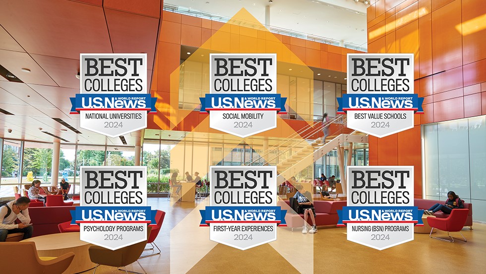 "Best Colleges" badges are displayed over a photograph of Adelphi's Nexus Building, with students are seen studying in comfortable chairs. Each badge reads "Best Colleges, U.S. News & World Report, 2024," along with the names of the category. The six categories are National Universities, Social Mobility, Best Value Schools, Psychology, First Year Experiences, and Nursing (BSN) Programs.
