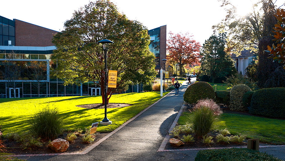 A view of Adelphi University's main Garden City Campus in the fall. The Ruth S. Harley University Center and pathways.