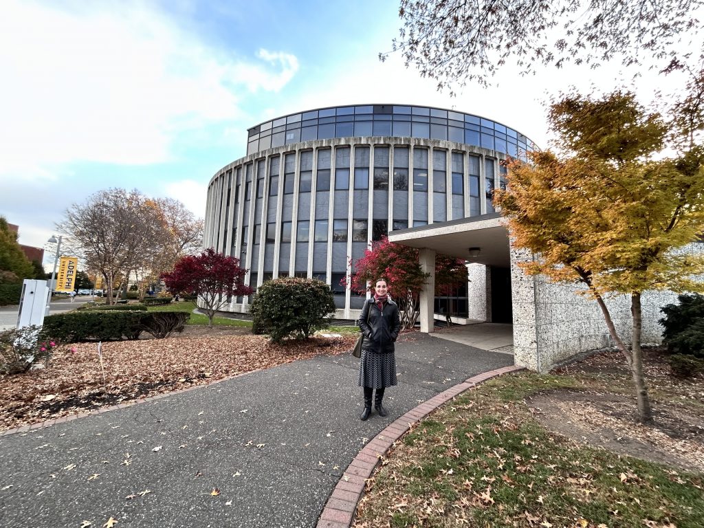 Dr. Gannon standing in front of the Science Building on Adelphi's Garden City campus