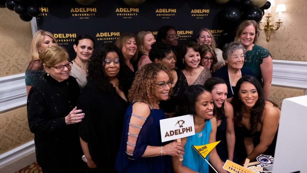 Group of women taking a photo at a gala event