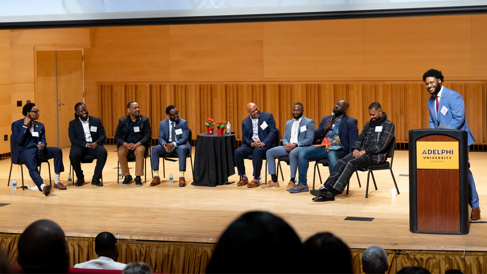 Featured speakers of the 2023 Black Men's Mental Health and Wellness Conference, on stage.