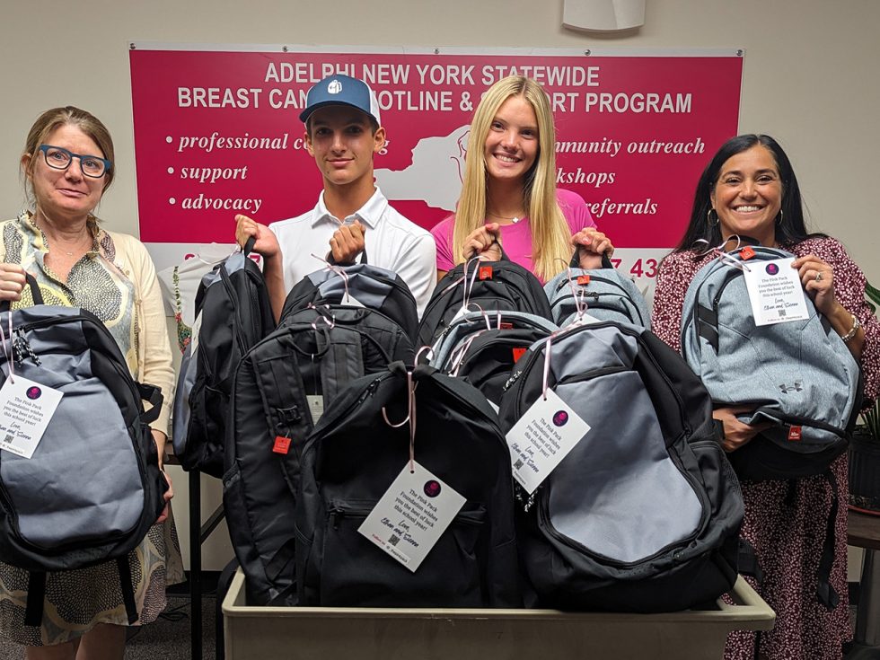 Nina Foley, LMSW, Ethan Light, Sienna Koke, Angela Papalia, LMSW holding donated backpacks for the The Pink Pack Foundation