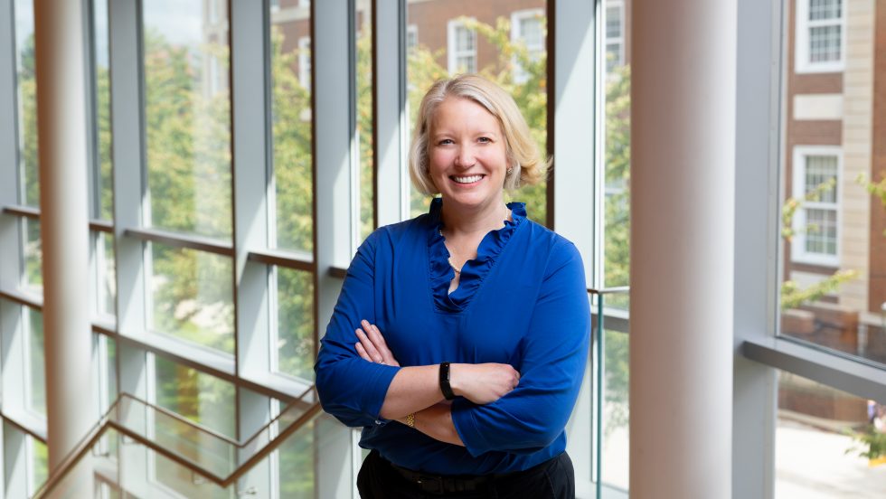 Andrea Ward, PhD standing in the Nexus Building at Adelphi University