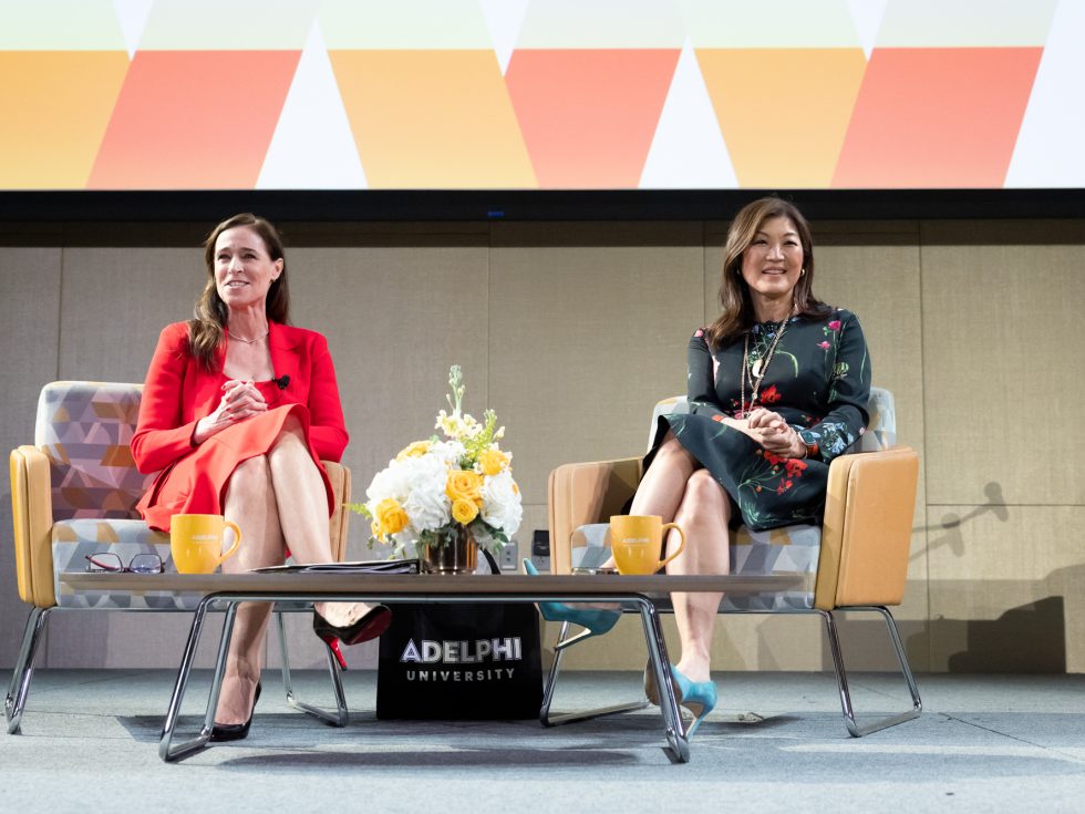 President Christine Riordan and keynote speaker Juju Chang seated onstage