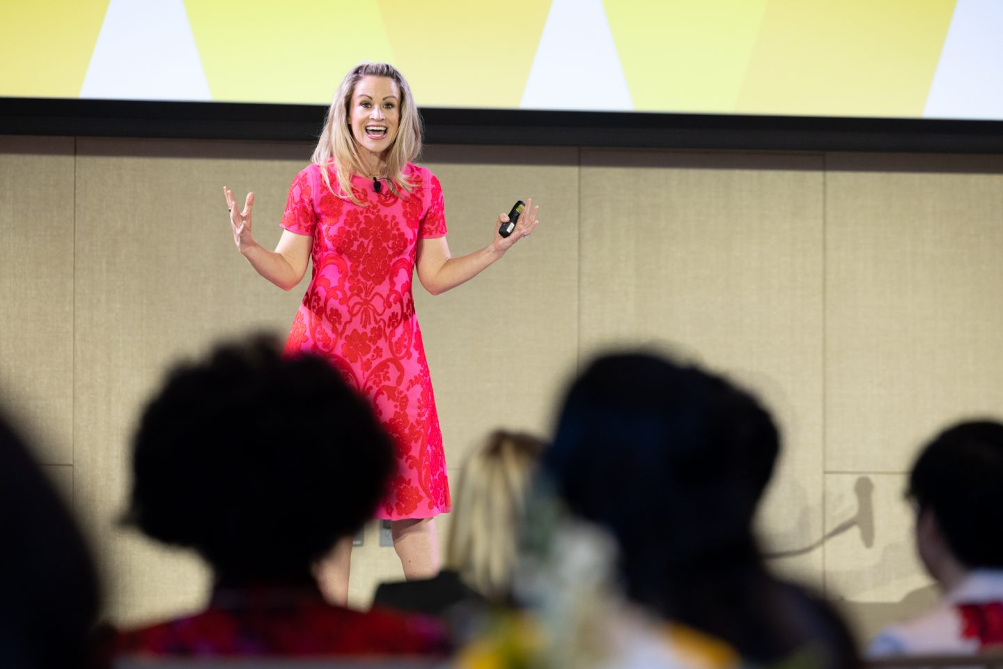Author Kindra Hall, onstage, shares tips on storytelling with the audience.